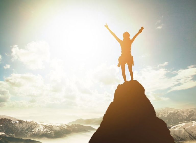 woman leader standing on mountain